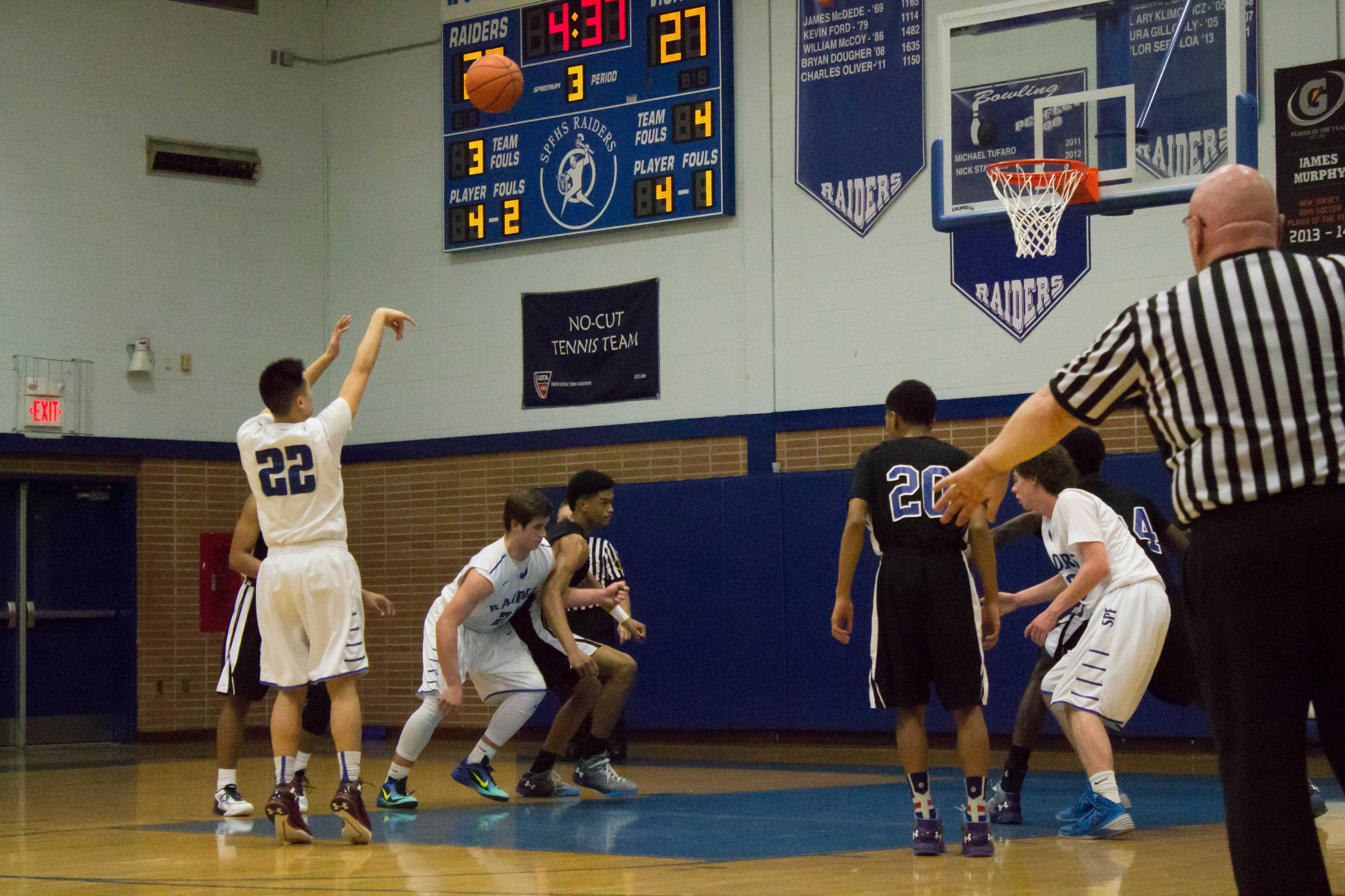 Aaron Lee takes a shot during a free throw. He eventually makes it. 