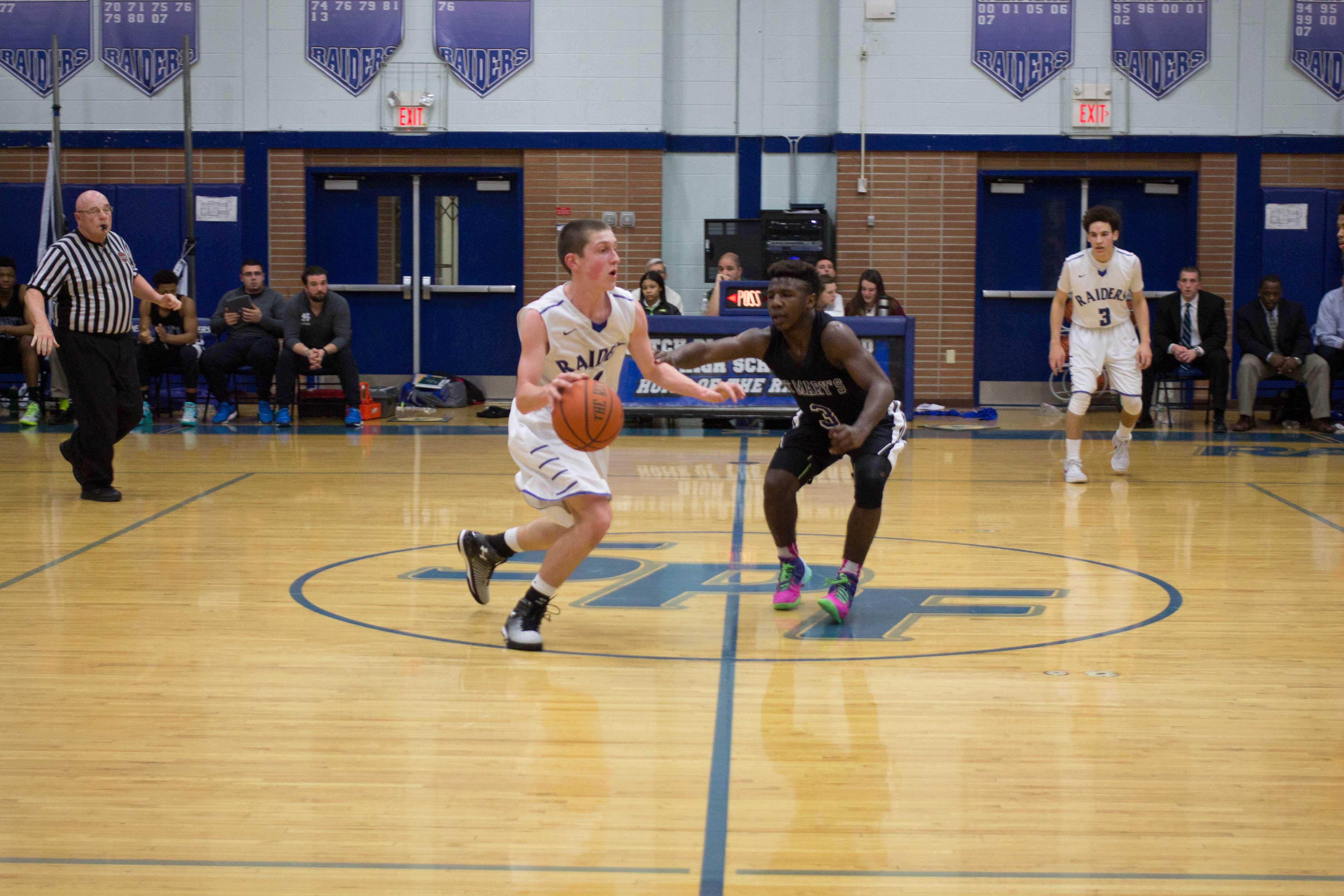 SPF’s Thomas Drubulis dribbles the ball away from St.Mary’s Manny Warren. 