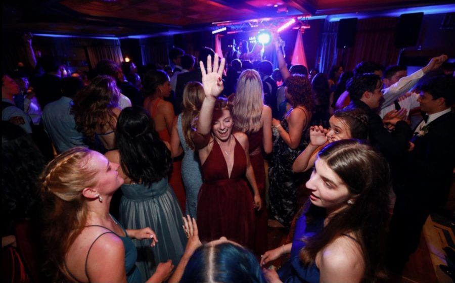 Seniors Allie Serio, Jamie Frank and others dancing at senior prom