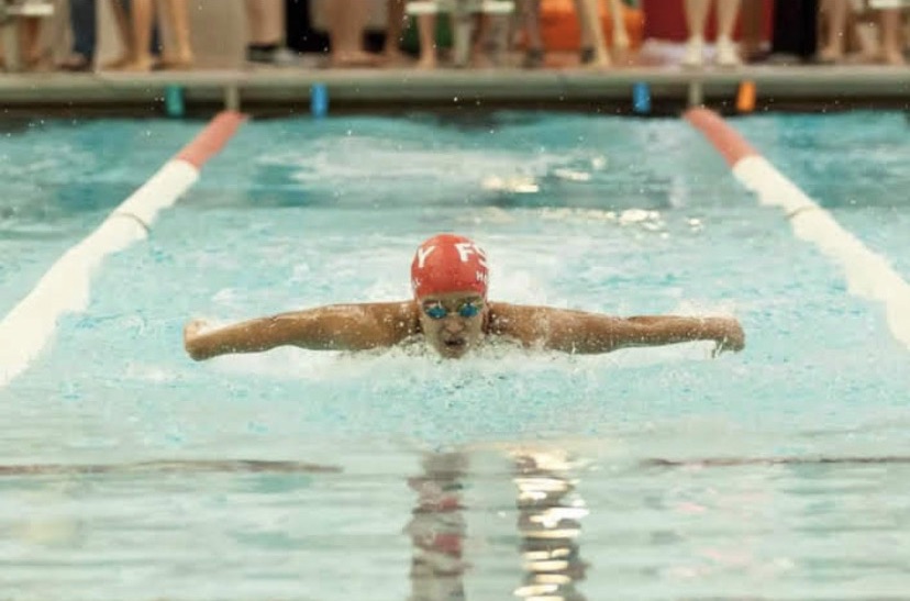 Senior Chloe Howell swims butterfly. Howell began to be increasingly passionate about social justice issues throughout her high school swimming career. 
