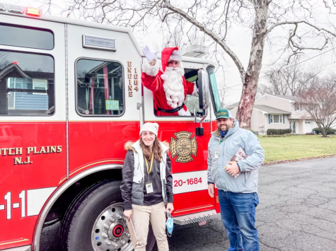 Santa Claus makes an appearance with two of the Recreation staff members. He has visited the families participating in the Holiday Home Decorating contest for many years. 