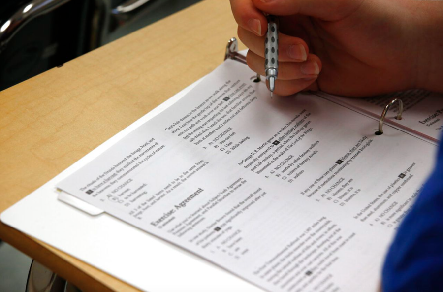 A student looks over the questions on their test. Many students spend months preparing and studying for the SAT.