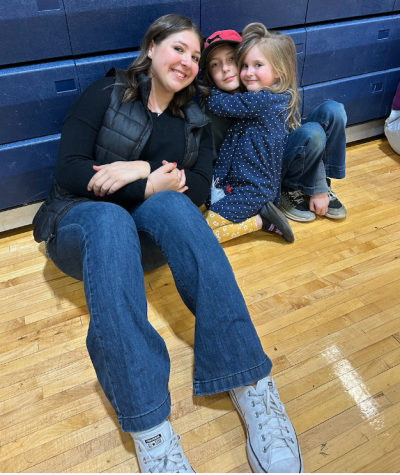 Junior Emersyn Teicher takes English Teacher Christina Held’s children to the gym. They played many fun games, including duck-duck-goose. 