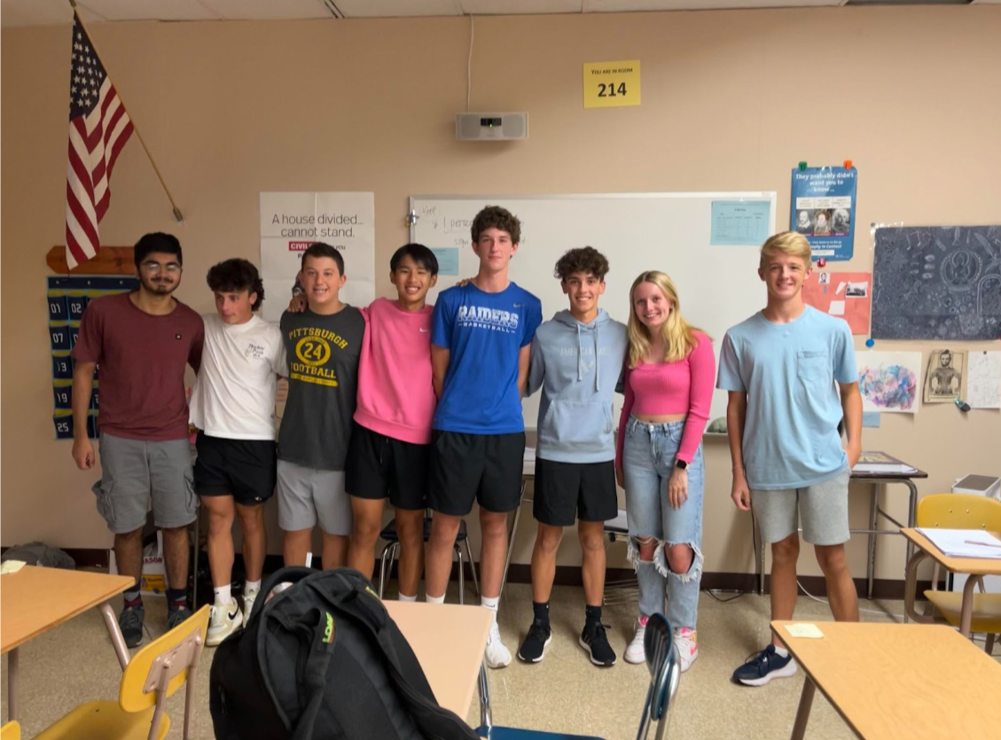 Board members of the History Club pose for a picture after their inaugural meeting (from left to right: Shaheryar Zeb, Asher Jackvony, Jonah Leske, Alexander Ho, Maxwell Nicholso, Spency Martin, Maddy Sheehy and John Buckley). There was a large turnout for those who attended the meeting and participated in the Kahoot at the end of the meeting. 
