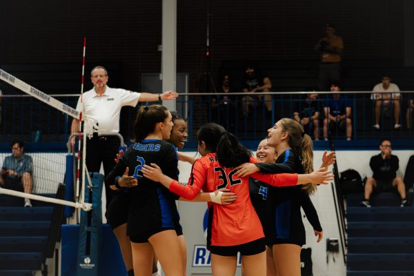 The SPF Girls Volleyball team loses 2-1 (25-23, 11-25, 21-25) to the Westfield Blue Devils on Thursday, October 5 at SPFHS. After winning the point, the girls celebrated as they tried to keep the momentum on their side.
