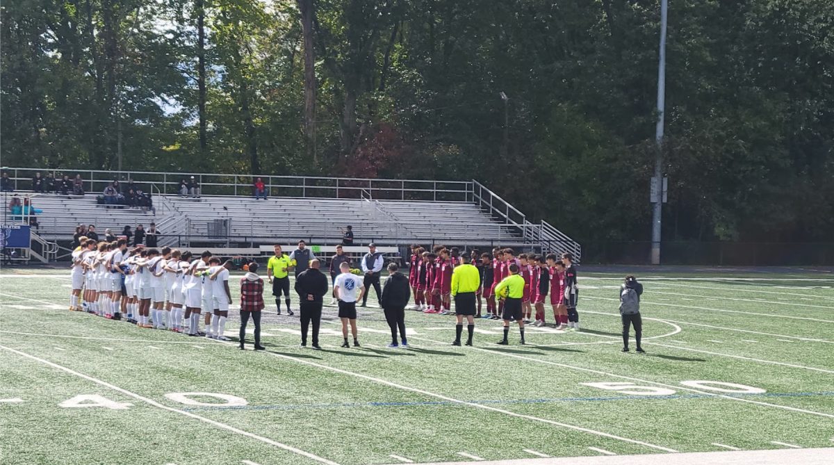 Both SPF and Union stand facing each other at midfield before the game as the referee gives the ground rules for the day. The Union Farmers defeated the SPF Raiders at Arthur L. Johnson High School on Sunday Oct. 15.