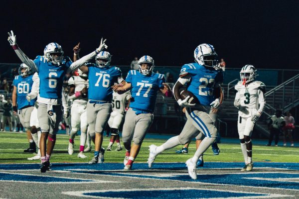 Junior running back Jayden Richards (23) runs into the endzone with his teammates celebrating behind him. The Raiders won 39-0 against the JFK Mustangs on Friday Night, Oct. 20 at Perry Tyson Field.