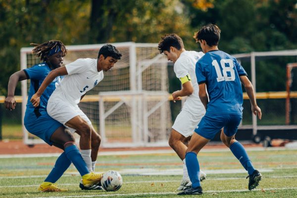 Junior Luca Passucci and Senior Sohem Rai try to play around the Westfield defenders against the Blue Devils on Nov. 4. Both Passucci and Rai were awarded postseason honors after great seasons. 