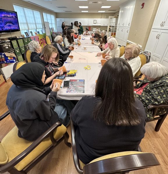 Senior Support Club members decorate flower pots during their first senior visit on Nov. 13. The club plans to visit more senior living homes in the future.