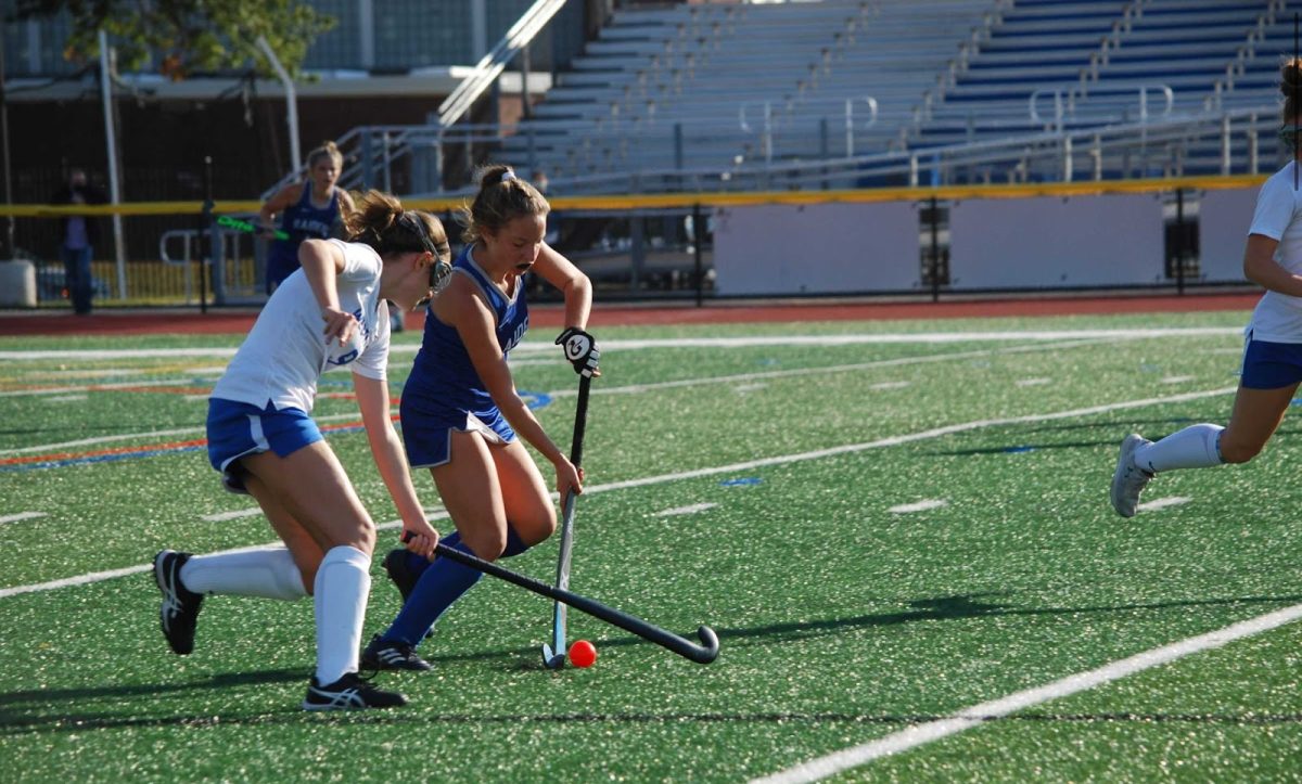 Olivia Stahley dribbles through defenders while playing for the SPFHS Field Hockey team. Stahley graduated in 2023 and now plays for the Scranton University Field Hockey team.