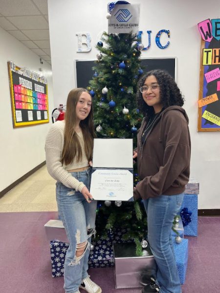 Care for Kids President Kelly Stewart and Vice President Vania Gonzalez proudly accepting their community service award from the Union County Boys and Girls Club in Plainfield, NJ. The club collaborated with the organizations many times each year since its founding in 2021. 

