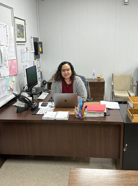Jasmin Hassan sits at her desk. She is excited to work in the Scotch Plains-Fanwood school district.