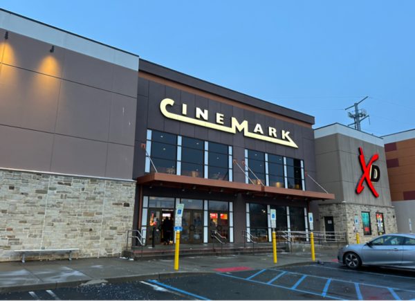 The “Cinemark” sign lights up as it gets dark outside. Many teenagers were excited for the release of “Anyone But You.” 