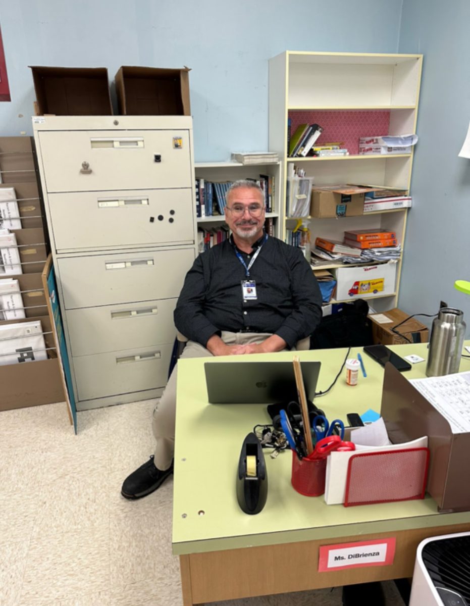 Jonathan Fletcher sits at his desk. He is excited to join the SPFHS Social Studies team for the remainder of the school year.  