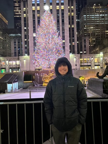 Brendan Campion poses in front of the tree at Rockefeller Center. He went to New York to visit family multiple times over the break. 