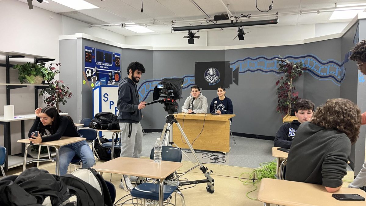 Scotch Plains-Fanwood students prepare for a live broadcast with a new system. Raider News acquired a new broadcasting system for higher-quality broadcasting and streaming.
