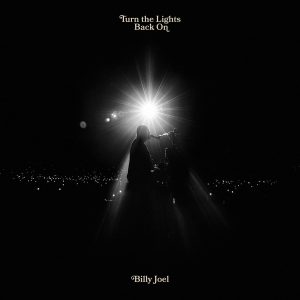 Billy Joel, age 74, sits at the piano playing one of his many famed songs, posing for the cover of his recent single ‘Turn the Lights Back On’. Joel’s new single was released on Feb. 1, 2024.