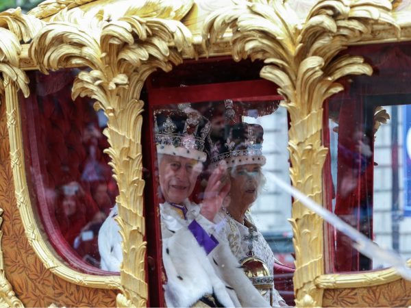 King Charles waves from a carriage on May 6, 2023, the day of his coronation. The coronation of King Charles was the first coronation since his mother, the late Queen Elizabeth II, became queen in 1952.