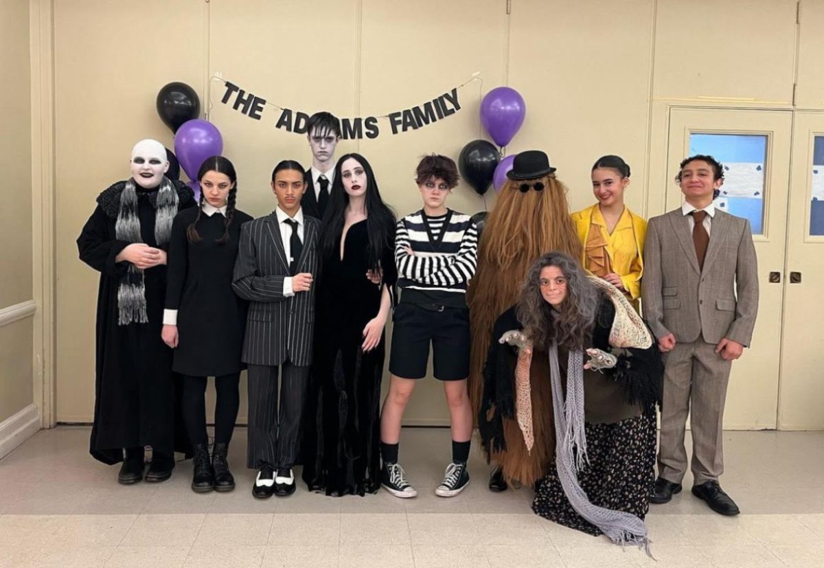 The+lead+cast+of+%E2%80%9CThe+Addams+Family%E2%80%9D+presents+themselves+at+the+character+breakfast+and+meet+and+greet.+They+performed+their+modified+opening+song+and+dance+number+to+the+families+attending+the+event.+%0A