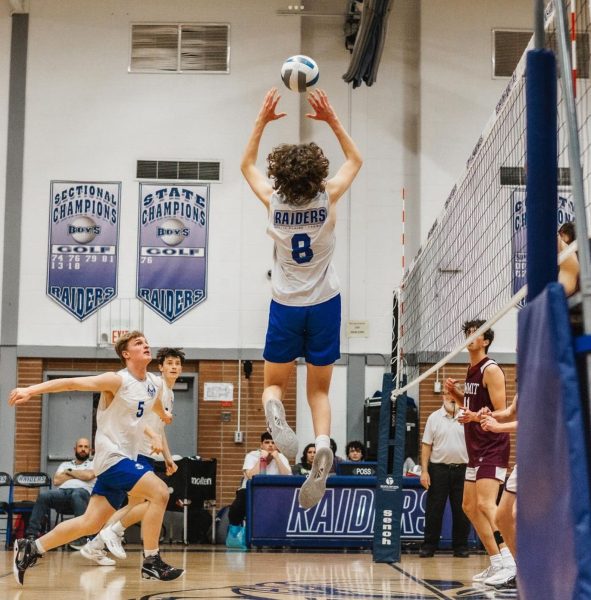 Senior Quinn Donahue (8) sets the ball for senior hitter Tim Ennis (2) who is getting ready to spike the ball. The Scotch Plains-Fanwood boys volleyball defeated the Summit Hilltoppers on April 16. 