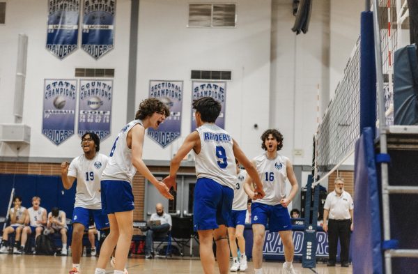 Pictured from left to right: senior Ryan Adams, senior Quinn Donahue, sophomore Brandon Indoe, and senior Ryan Pierson celebrating after a point keeping SPF in the lead. 