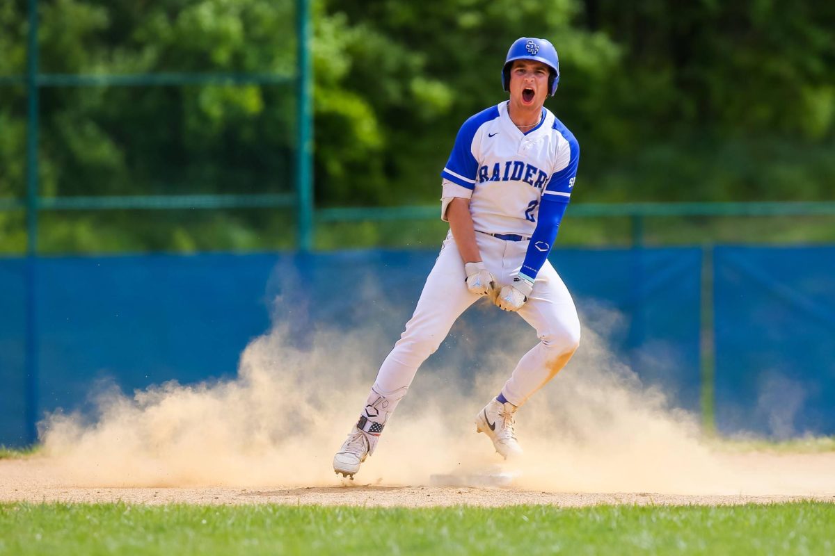 Sophomore+Joe+LaRosa+celebrates+after+sliding+into+second+base+in+the+bottom+of+the+first+inning.+The+Scotch+Plains-Fanwood+Raiders+baseball+team+defeated+the+Glen+Ridge+Ridgers+11-1+at+SPFHS+on+Saturday%2C+April+27.