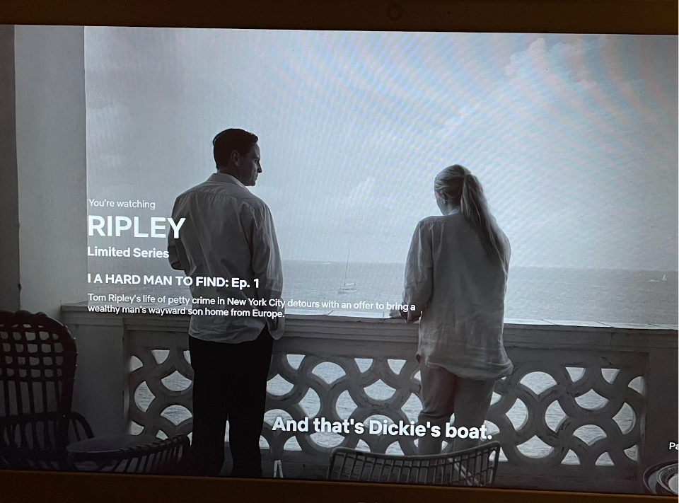 Tom Ripley (Andrew Scott) and Marge Sherwood (Dakota Fanning) converse on a balcony in Italy. In the series, Ripley traveled to Italy to search for Dickie Greenleaf, Sherwood’s boyfriend and the son of a very wealthy man.