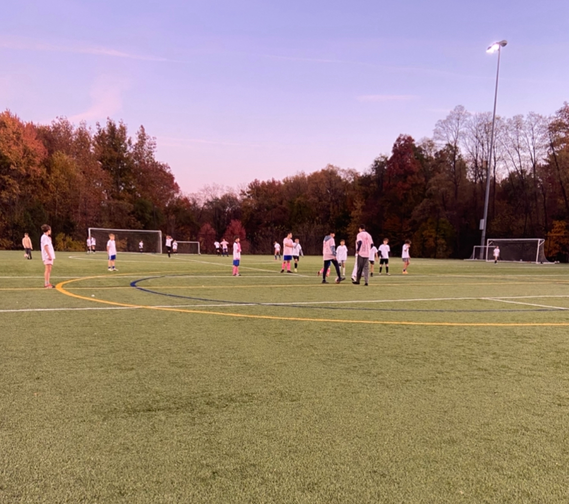 Volunteers and players went head-to-head in a friendly game. They played a 20-minute long full-sided game.