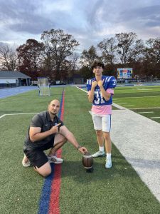 Freshman kicker Colby Martin poses alongside special teams coach Marc Fabiano. Martin has played in the final four games of the regular season after getting injured during the opening game.