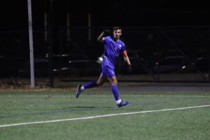 Senior Devin Pearce celebrates after a header goal. The Raiders beat Newark East Side 5-0 on Tuesday Nov. 12, and advanced to the sectional finals where they will face Westfield.