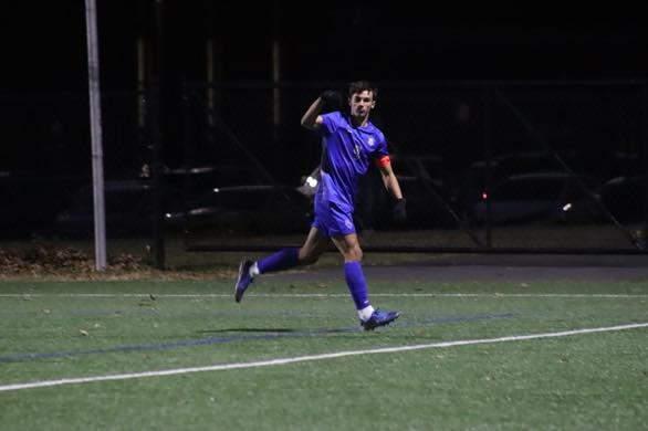 Senior Devin Pearce celebrates after a header goal. The Raiders beat Newark East Side 5-0 on Tuesday Nov. 12, and advanced to the sectional finals where they will face Westfield.