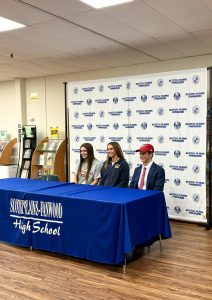 All three athletes, Juliana Doran, Sam Friscia and Ryan Mauer celebrate Signing Day. They are all committed to playing sports throughout college. 