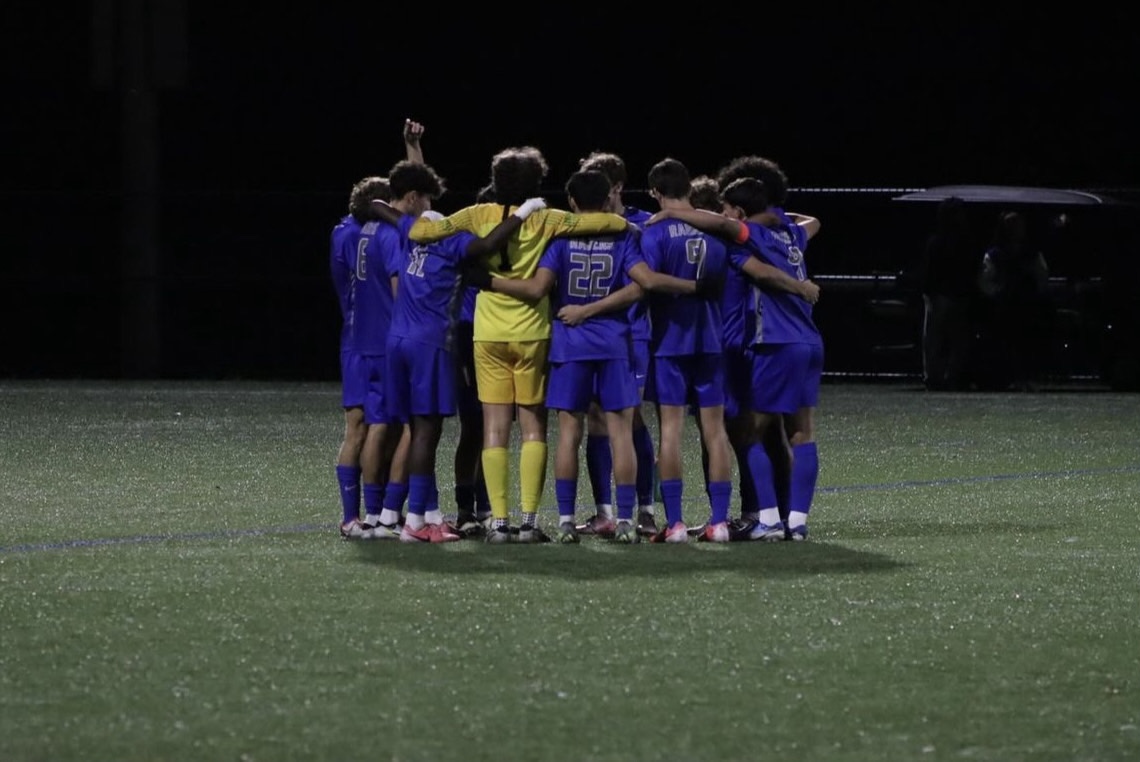 The Scotch Plains-Fanwood boys soccer team huddles before kickoff. The Raiders topped Ridgewood 3-2 on Tuesday Nov. 19, in a double overtime thriller.