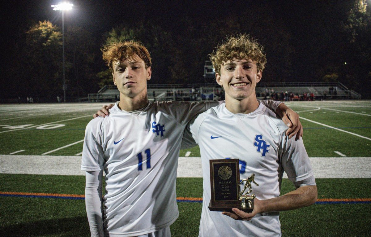 Ryan Catallo (11) and Jeffery Noonan (12) hold the 2024 JV Boys soccer county championship trophy after beating Elizabeth 5-4 on penalty kicks. 