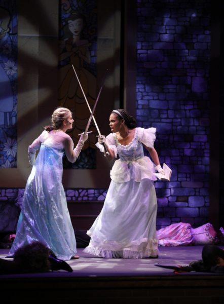 Senior Grace Bottomy (left) and junior Sofia Vanterpool (right) engage in a sword fight as The Snow Queen and Cinderella, respectively. “Game of Tiaras” focused on three sisters who are princesses and their conflicts over land and the throne, the other sister being Belle, who was portrayed by senior Maggie Hayes.
