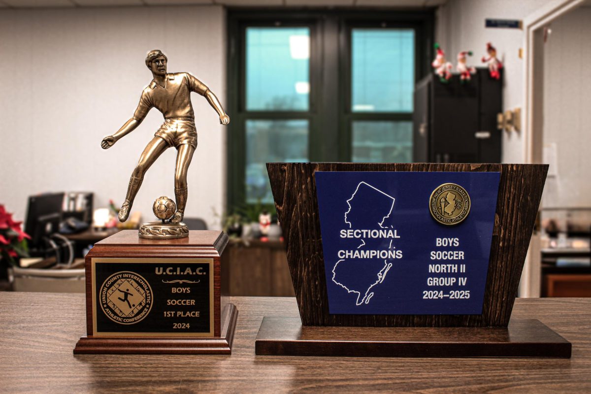 The Main Office presents the U.C.I.A.C. Union County Championship and North II Group IV Sectional Championship Trophies both won by the 2024-2025 boys soccer team. 