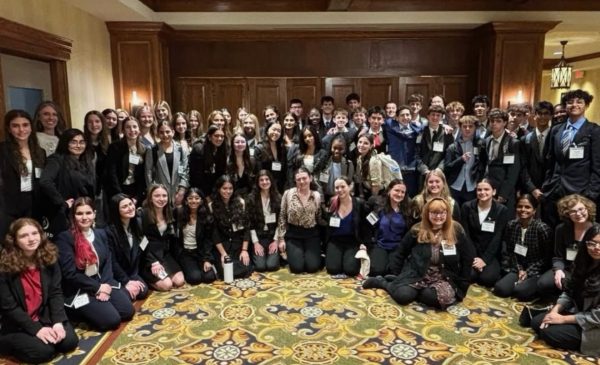 The Scotch Plains-Fanwood delegation poses together for a photo after a long day of debate and travel. The delegation had 71 delegates attend the conference this year. 