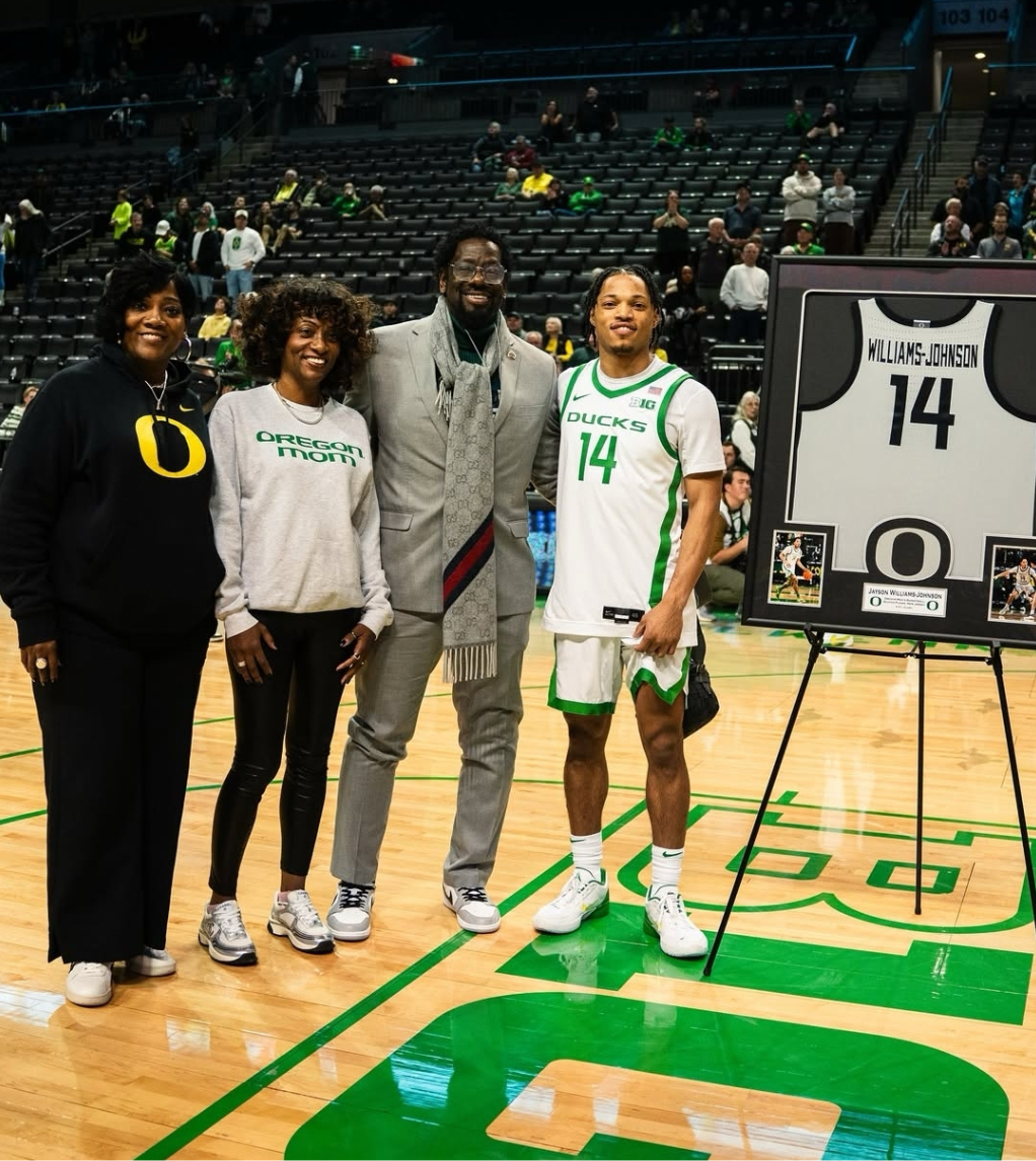 Senior guard Jayson Williams-Johnson stands with his family during his senior night. Williams-Johnson attended SPFHS and was a key member of the Raider basketball team.