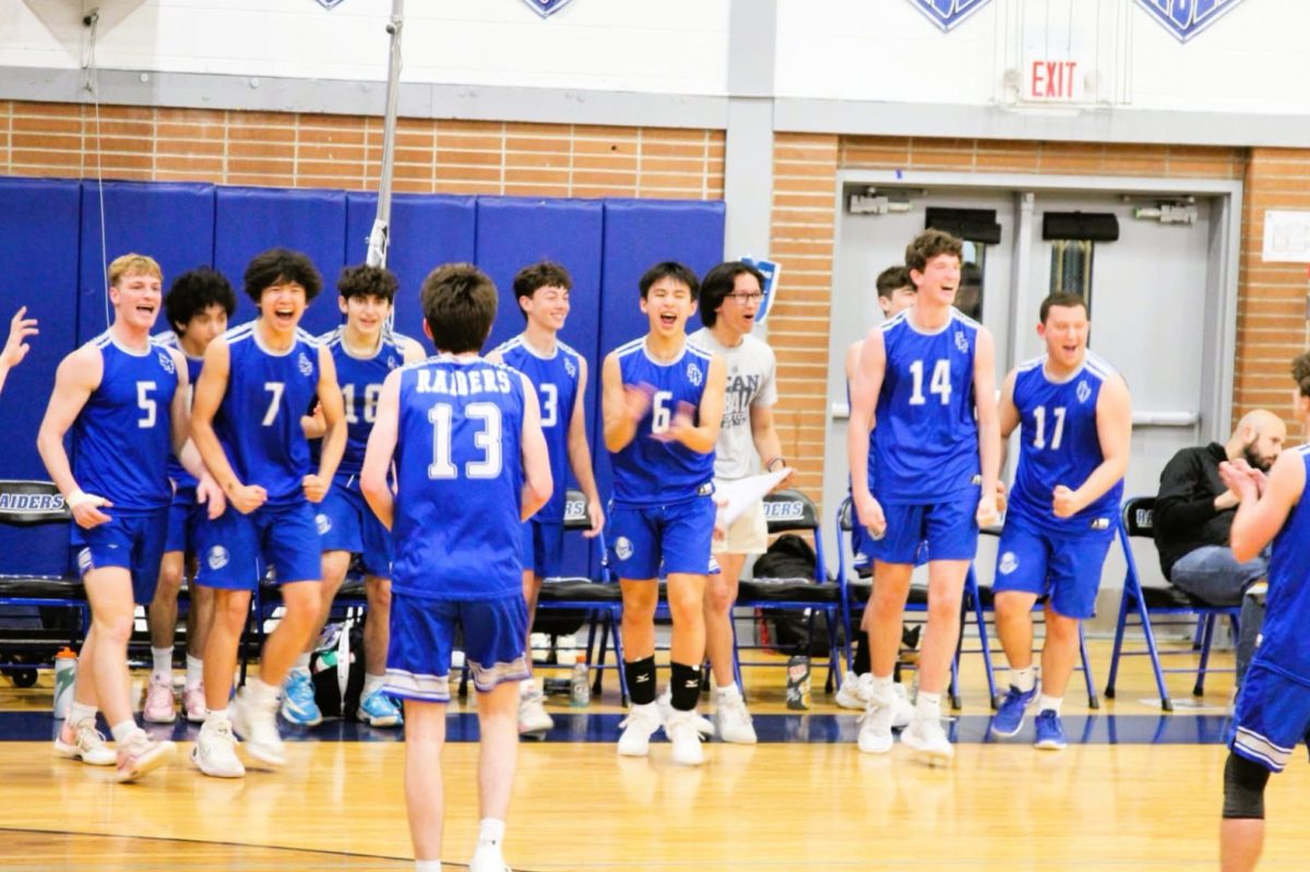 The SPFHS boys volleyball team celebrates after capturing the third set against No. 1 Old Bridge. The Raiders snapped the Knights’ 53-game win streak on Tuesday, May 6. 
