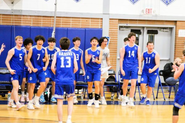 The SPFHS boys volleyball team celebrates after capturing the third set against No. 1 Old Bridge. The Raiders snapped the Knights’ 53-game win streak on Tuesday, May 6. 
