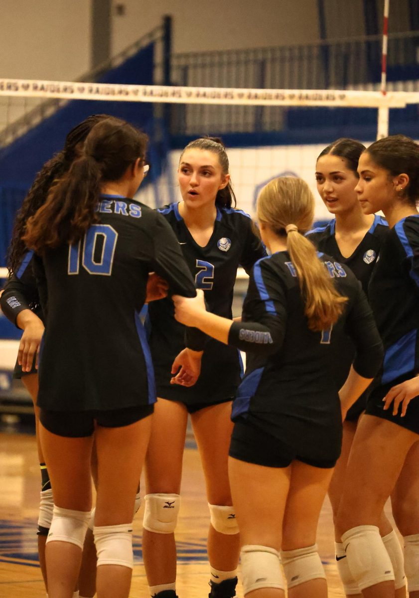 The SPF girls volleyball team huddles after a point to discuss. The Raiders notched back to back wins under new head coach Sarah Catherina to improve to 3-5.