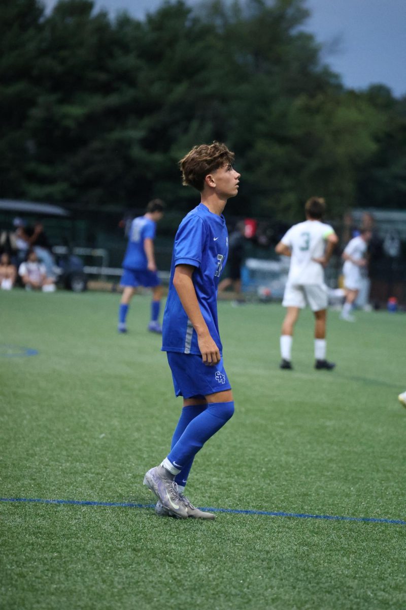 Sophomore defender Michael Di Iorio looks up in the sky, taking a breath. Due to weather inclement, this match was postponed for Oct. 1 covered in suspense. 