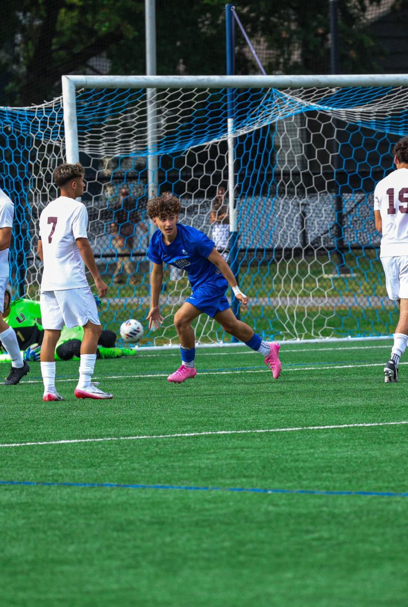 Sophomore midfielder Anastasio (Taso) Pavlou runs to the corner in triumph, finding the back of the net just minutes into the match. This game resulted in a 5-1 win for the Raiders.