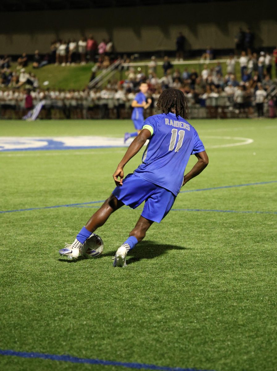 No. 11 senior captain Jayvon Young attacks the midfield with the ball moments before delivering the perfect through ball to junior striker Jack Tse for a goal against their rival town Westfield. The match concluded in a 1-0 win for the Raiders making them now 10-0-2 in their exciting season.
