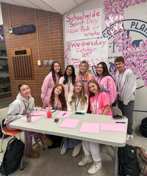 SMAC members tally up which grade had the most spirit, while also participating in the Pink Out. A lot of hard work was put into the event.