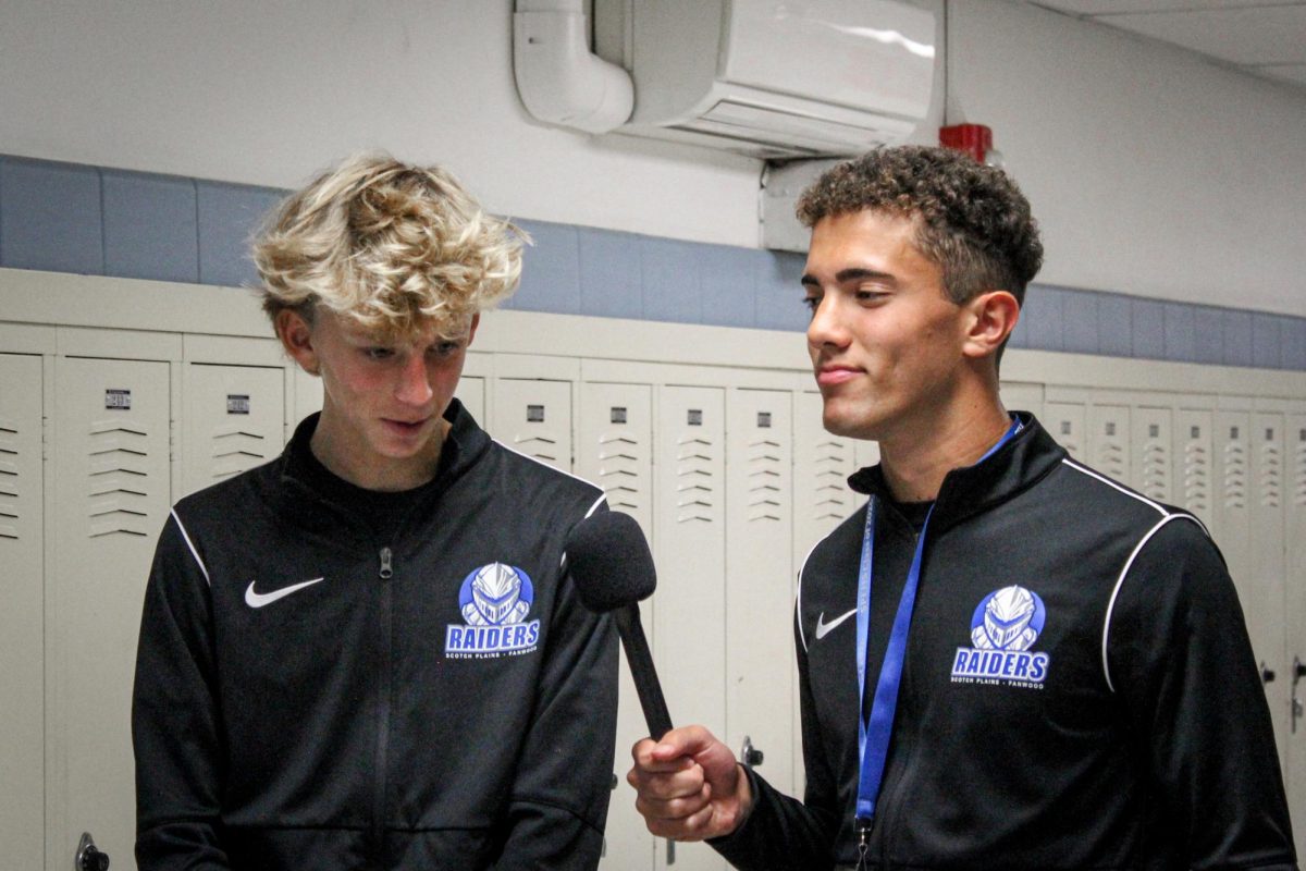 Students from Raider News conduct interviews about the boys soccer season. 

