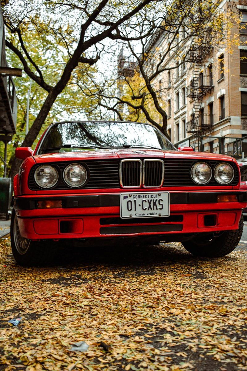A vintage BMW shines in the fall air. 
