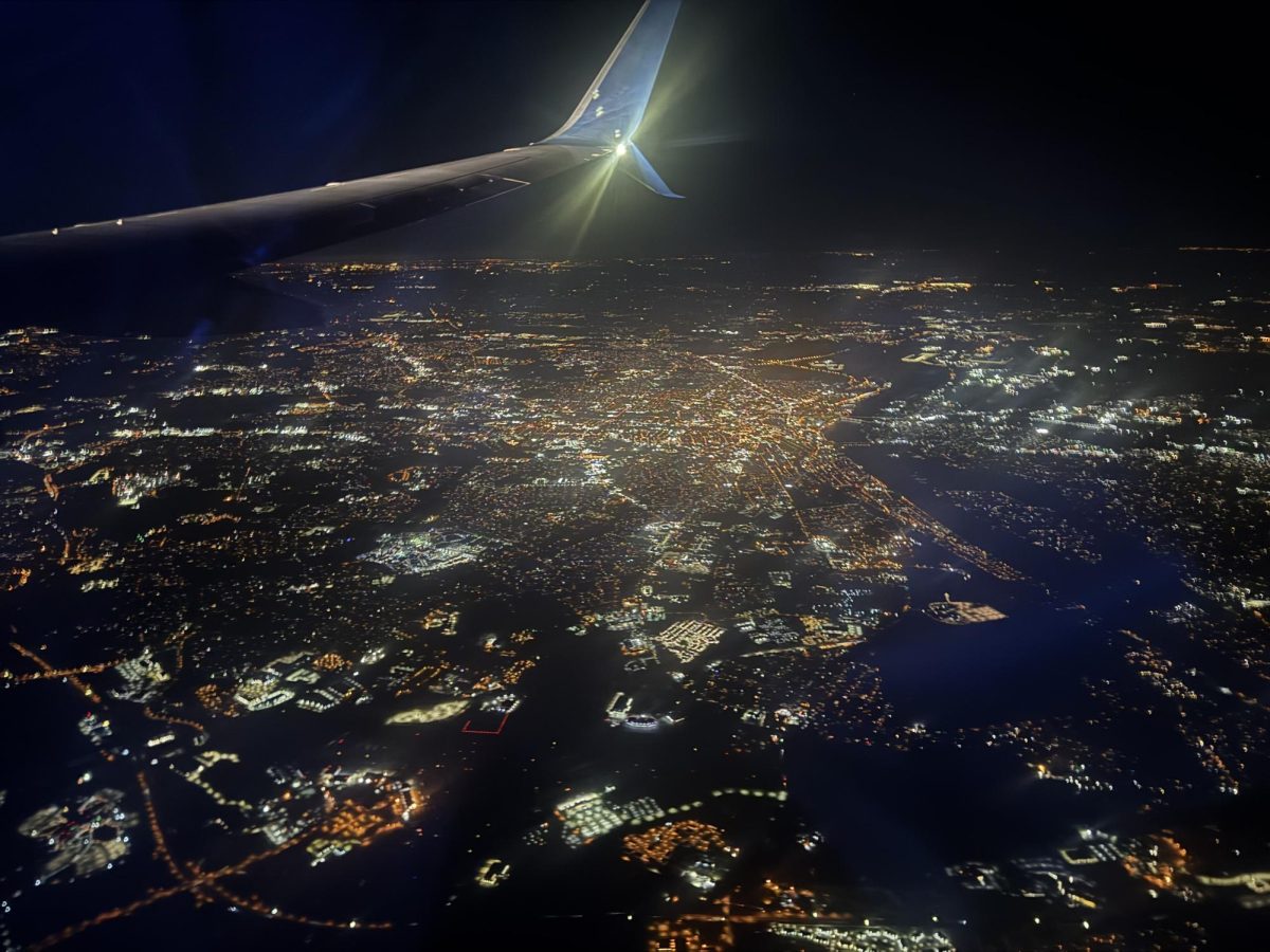 Flying over NYC, the city never sleeps as the city lights up on a winter night.