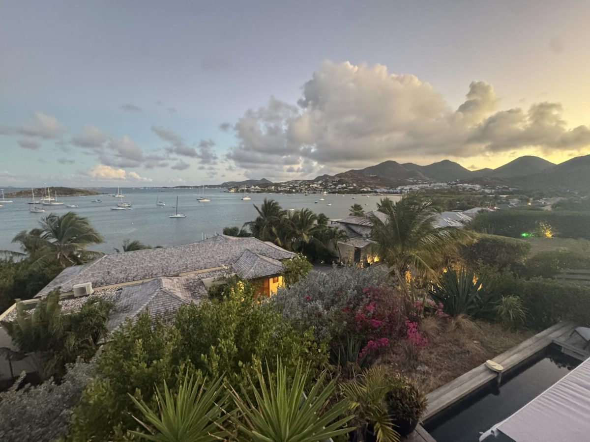 The sunset over the mountains and water on the French side of Saint Martin.