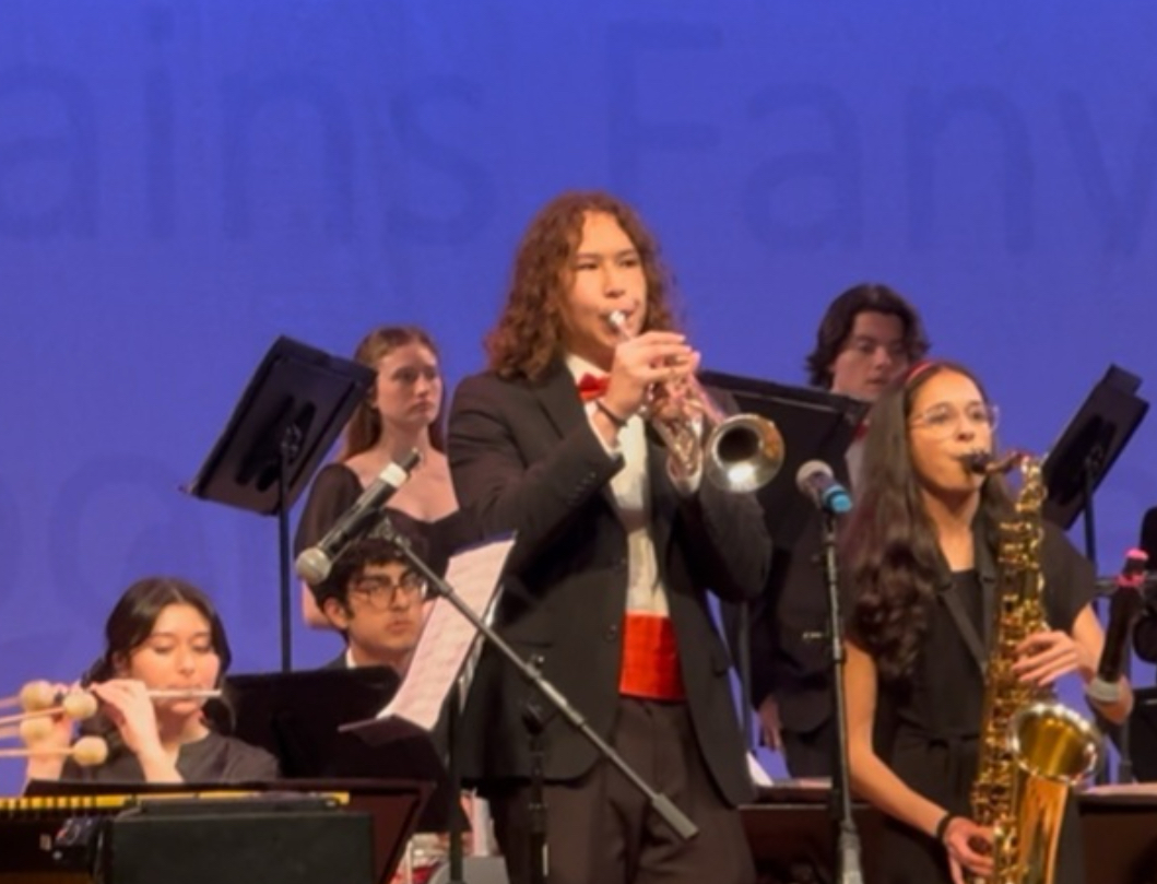 Junior Aleksander Stevens plays the trumpet for SPF Moonglowers for
a competition. He has performed in the group since his freshman year.